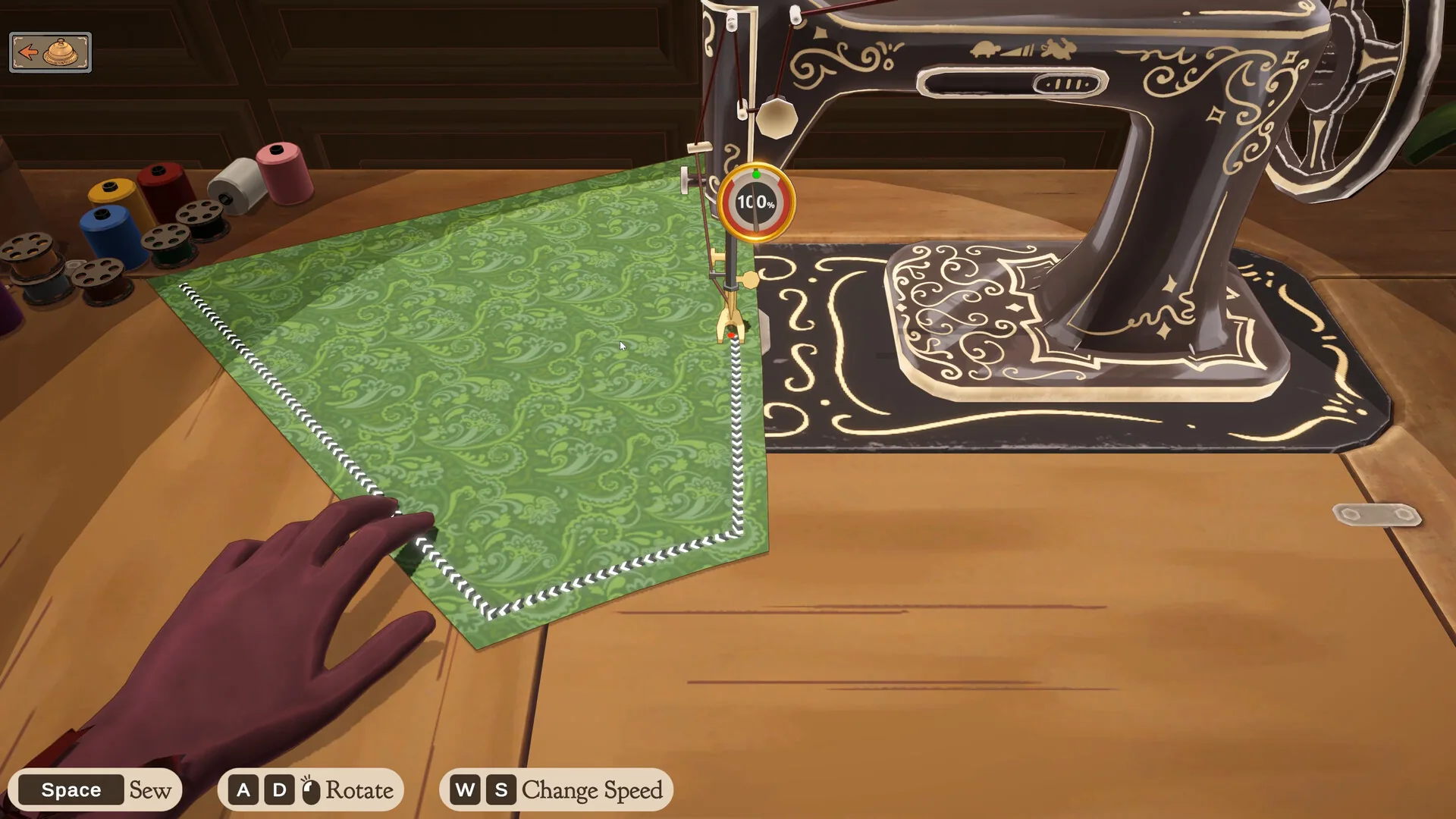 Green fabric under the sewing machine with Space, A/D, and W/S control prompts